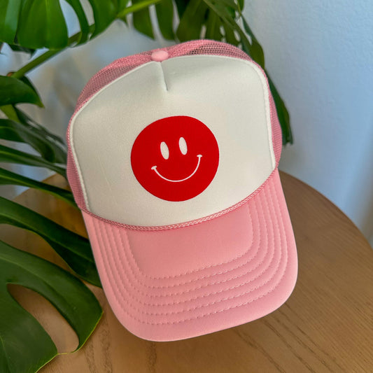 the trucker - red smiley on light pink/white