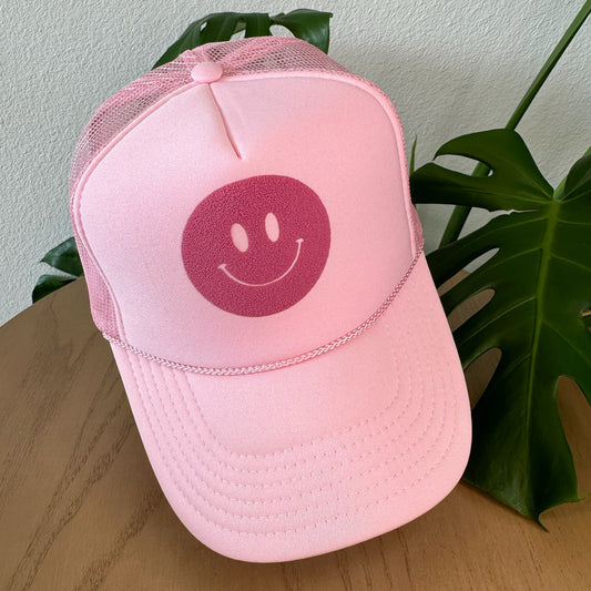 the trucker - mauve pink smiley on light pink