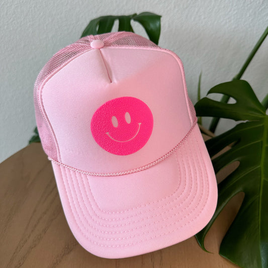 the trucker - bright pink smiley on light pink