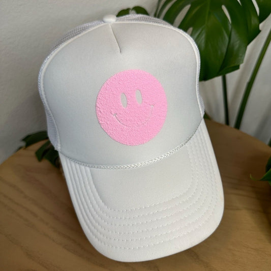 the trucker - light pink smiley on white