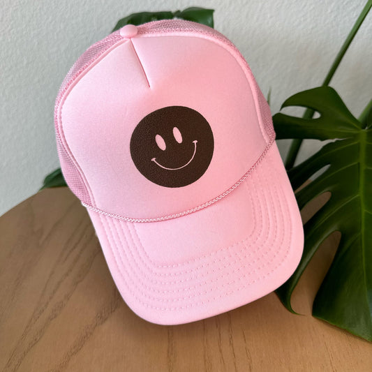 the trucker -  brown smiley on light pink