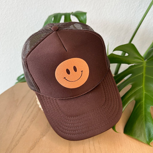 the trucker - rust smiley on chocolate